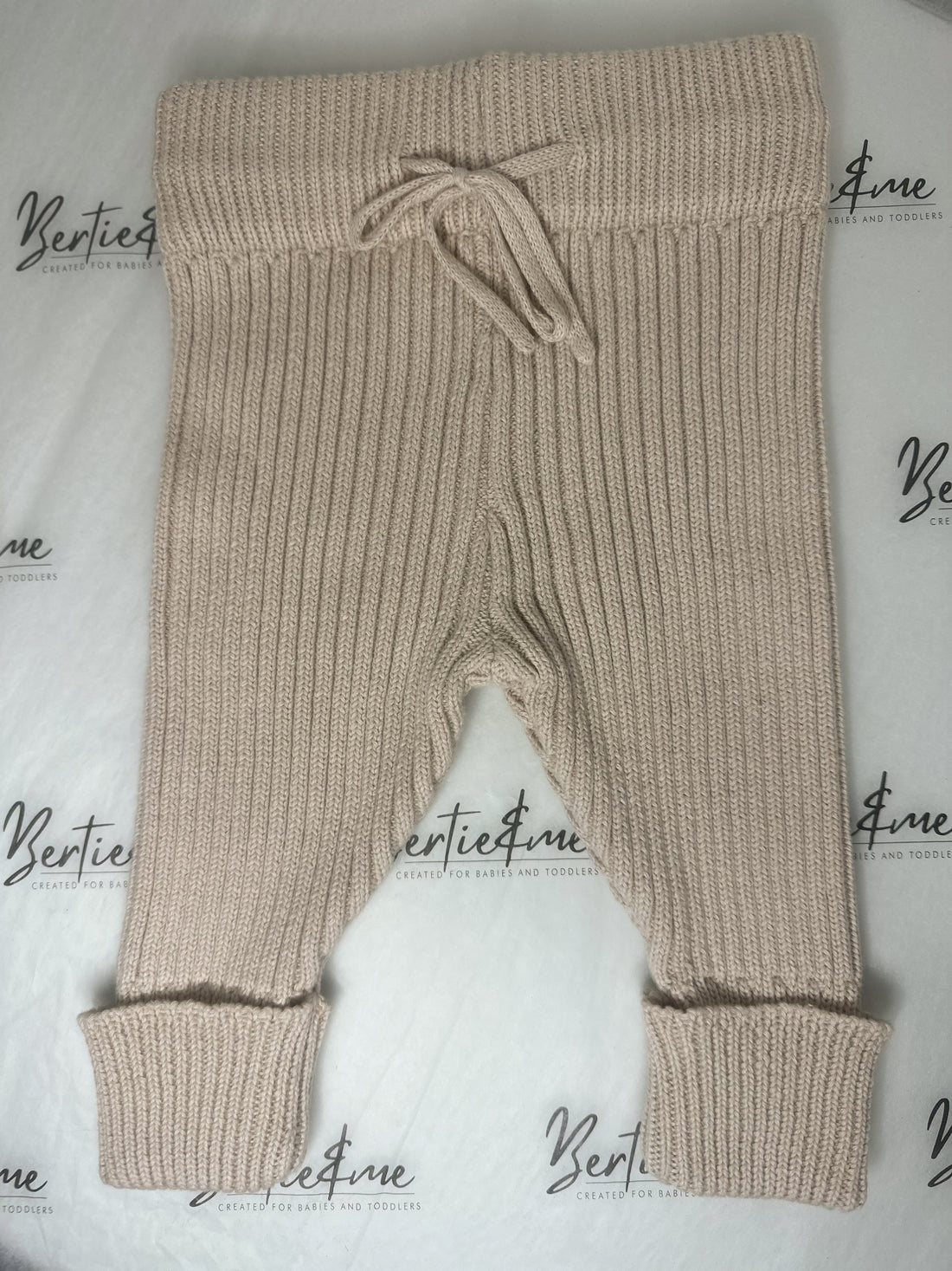Beige knitted trousers